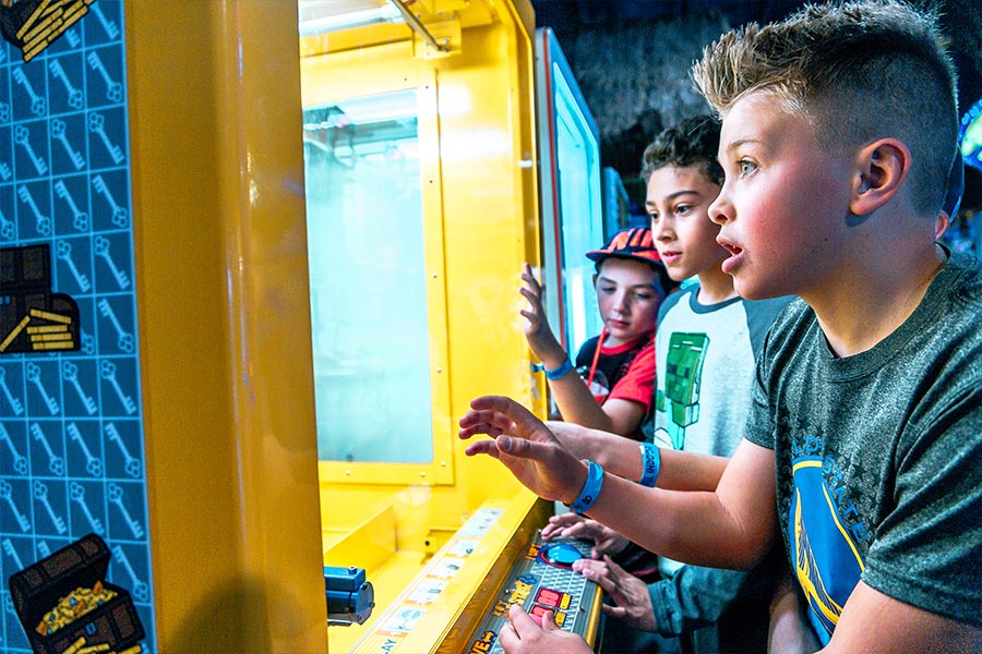 Kids Playing Arcade Prize Game