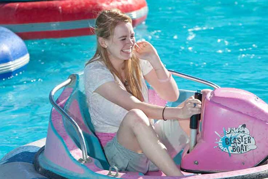 Teenage Guest Laughing On Bumper Boat
