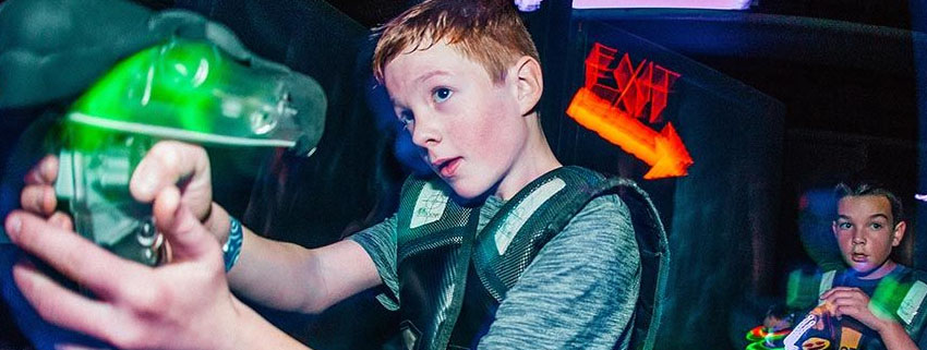 Young Boy Playing Lazer Tag