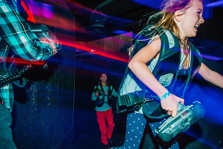 Girls Running Playing Lazer Tag