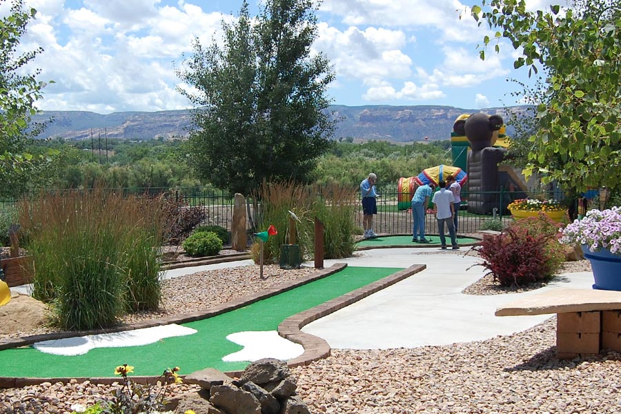 Guests Playing Miniature Golf - Scenic View